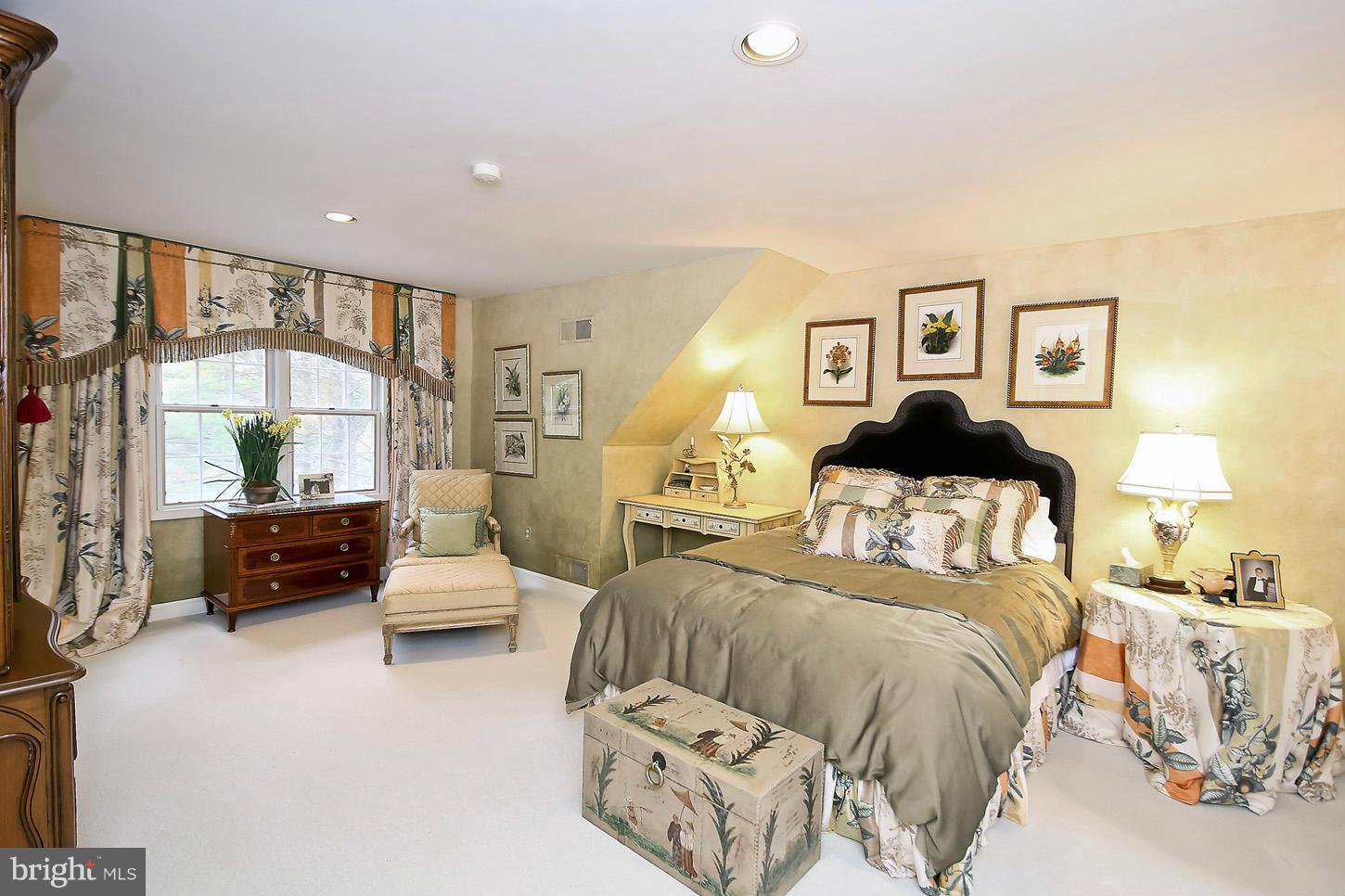 10112 Norton Road Potomac, MD 20854 - Photo 23 of 30 a bedroom with a large bed and a couch