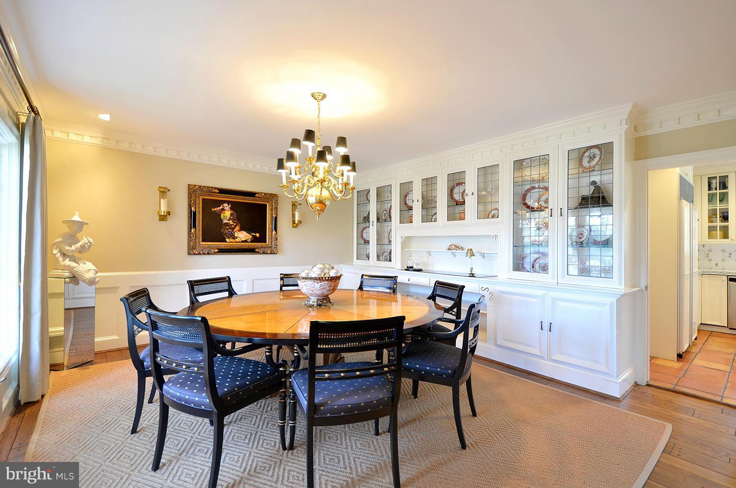 10112 Norton Road Potomac, MD 20854 - Photo 10 of 30 a view of a dining room with furniture and chandelier