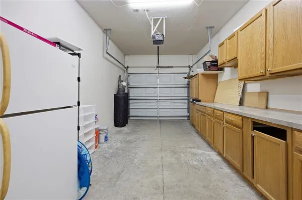 a kitchen with stainless steel appliances a refrigerator and a stove