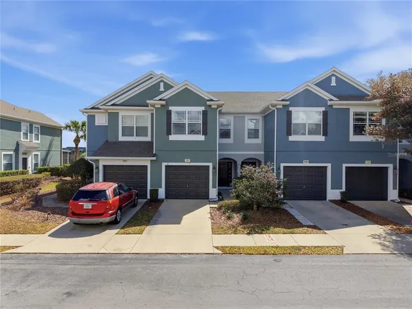 an aerial view of houses with outdoor space