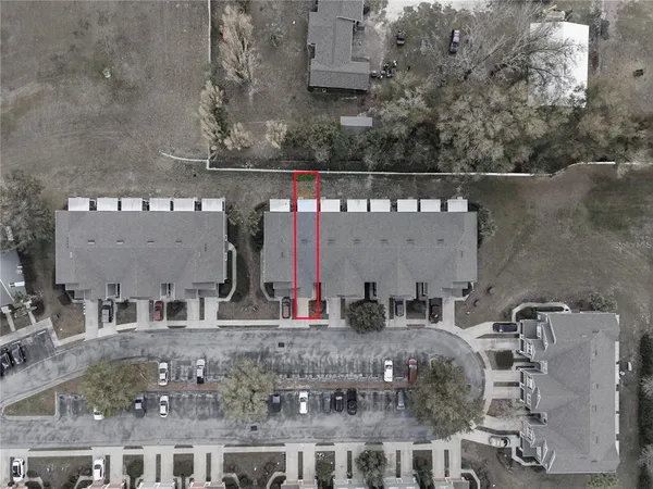 an aerial view of a house with a swimming pool