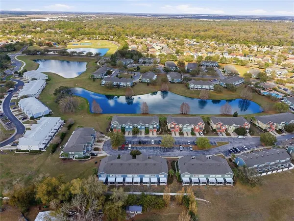 an aerial view of a house with yard