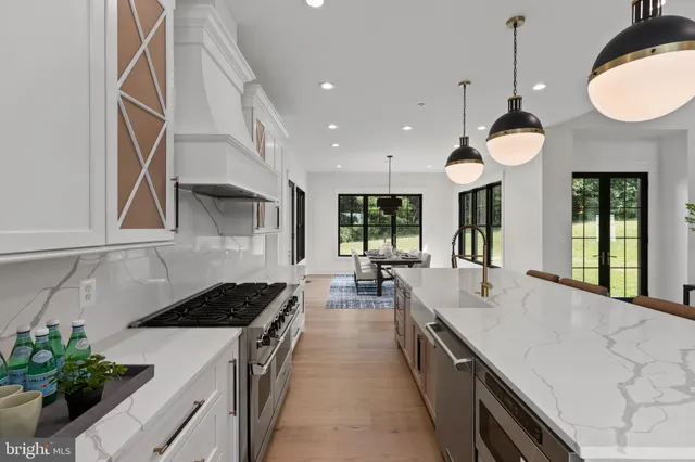 a living room with table and chairs