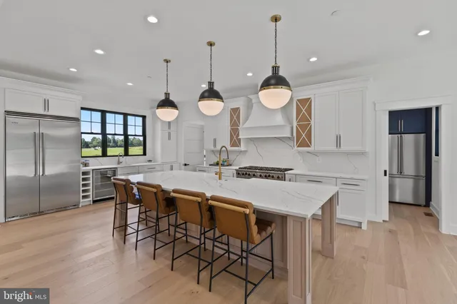 a kitchen with a table and chairs in it