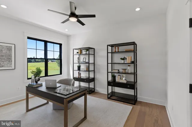 a spacious bedroom with a bed and a window