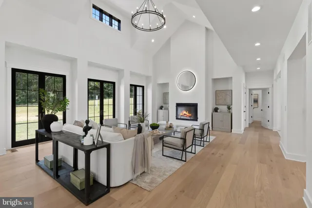 a bedroom with a large bed and a large window