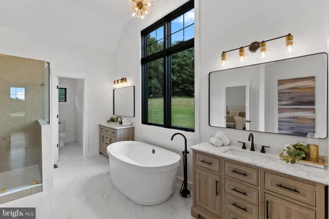 a bedroom with a bed and a ceiling fan