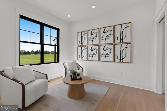 a bedroom with a bed lamps and window