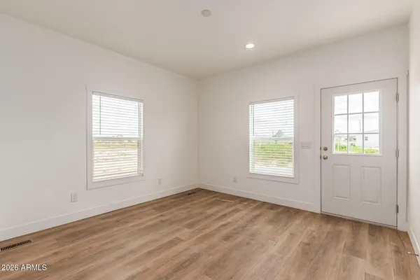 a bathroom with a granite countertop sink a mirror and a shower