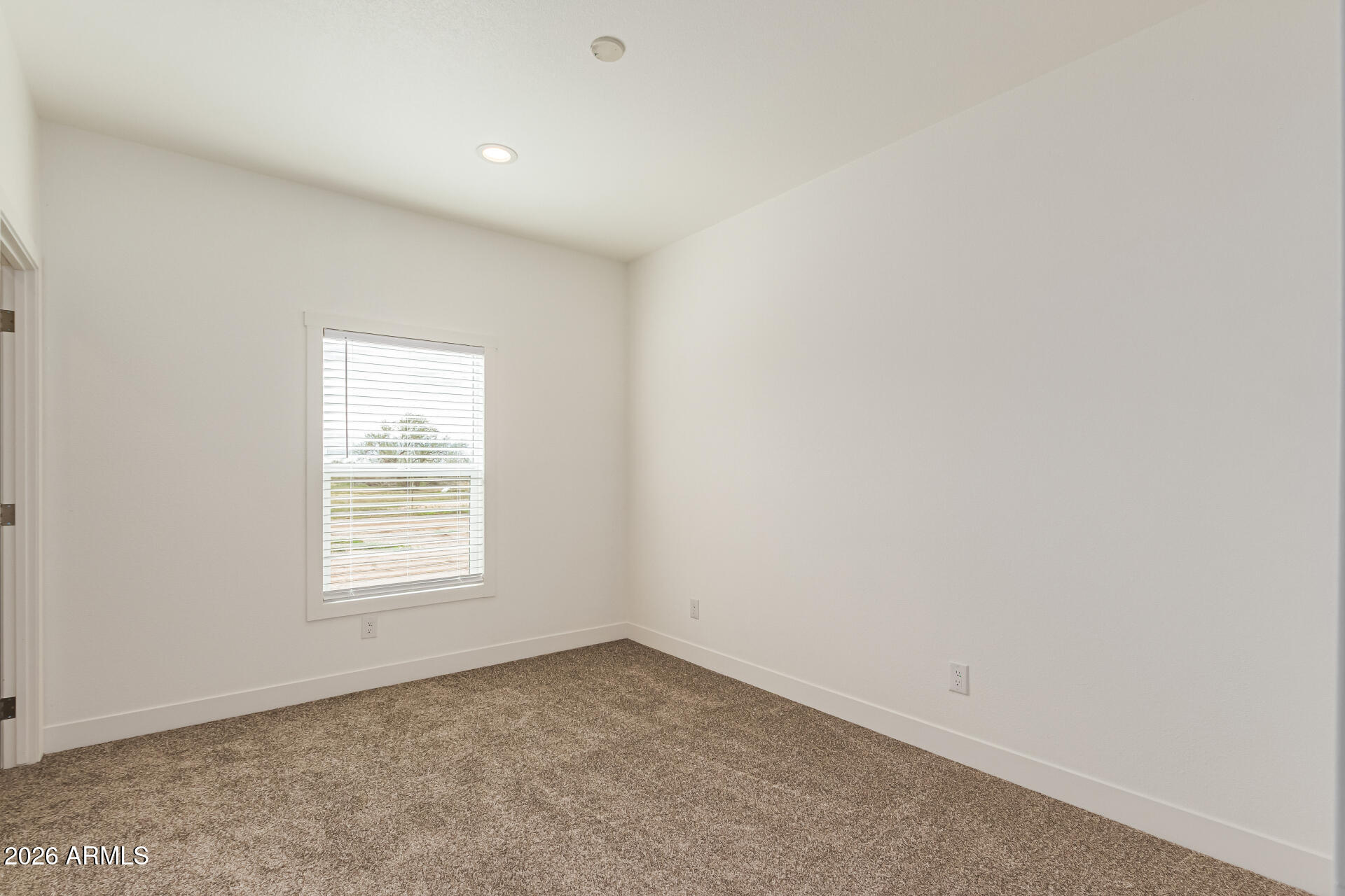 10350 East Shallow Canyon Road San Tan Valley, AZ 85143 - Photo 28 of 40 an empty room with a window