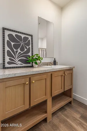 a bathroom with a sink and a mirror