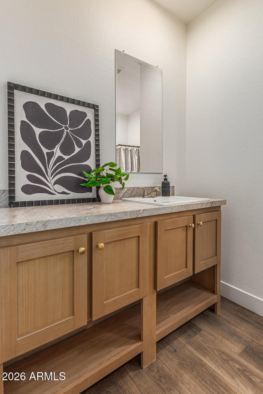 10350 East Shallow Canyon Road San Tan Valley, AZ 85143 - Photo 31 of 40 a bathroom with a sink and a mirror