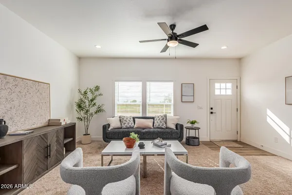a living room with furniture and a window