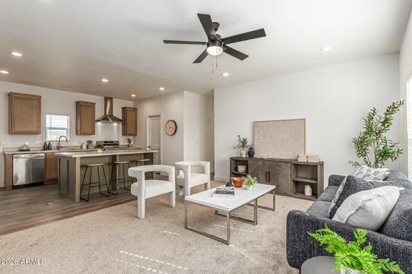 a living room with furniture and a large window
