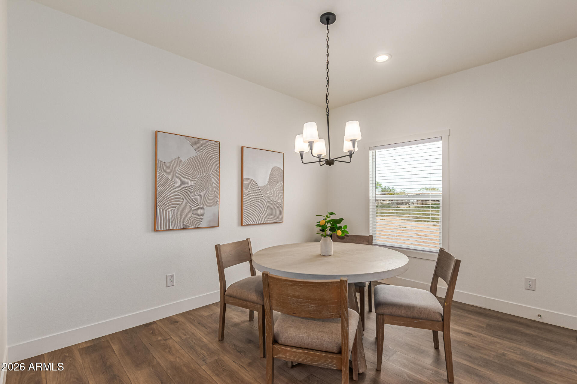 10350 East Shallow Canyon Road San Tan Valley, AZ 85143 - Photo 8 of 40 a view of a dining room with furniture window and wooden floor