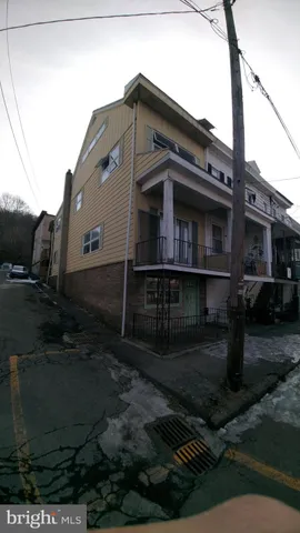 a front view of a house with yard