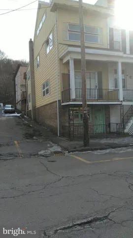 a view of a house with a street