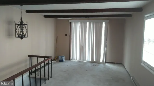 a view of a hallway with windows