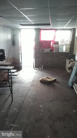 a room with gym equipment and a large window