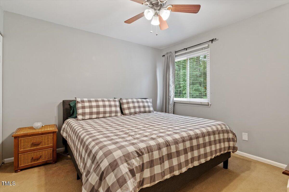 712 Godwin Court Raleigh, NC 27606 - Photo 17 of 27 a bedroom with a bed and a window