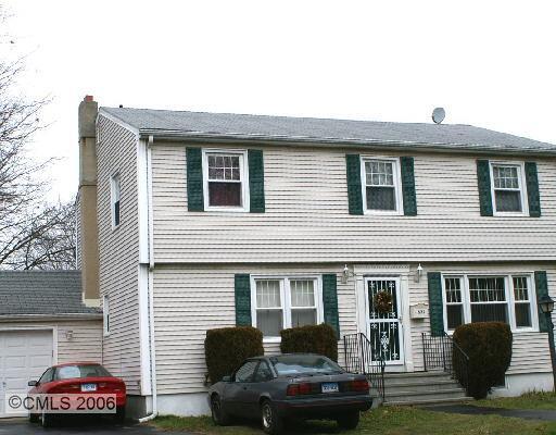 575 South Benson Road Fairfield, CT 06824 - Photo 1 of 1 a front view of a house with cars parked