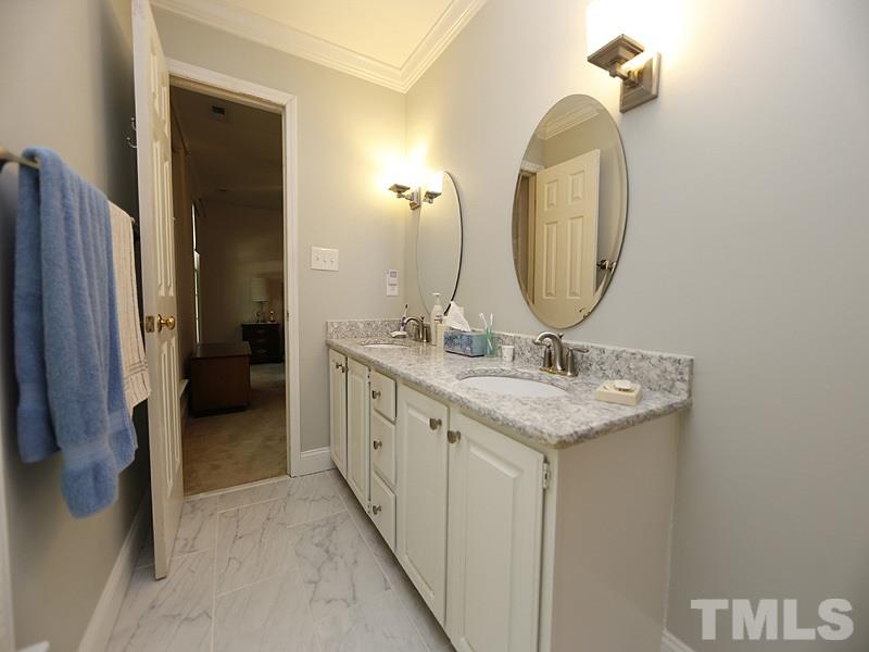 4812 Oak Way Raleigh, NC 27613 - Photo 9 of 18 Solid surface countertops and very nice flooring make this master bath a winner.