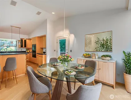 a view of a dining room with furniture and window