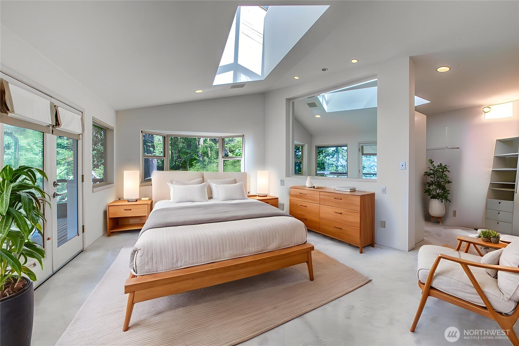 121 Switchback Road Orcas Island, WA 98245 - Photo 18 of 35 a bedroom with a bed and large windows