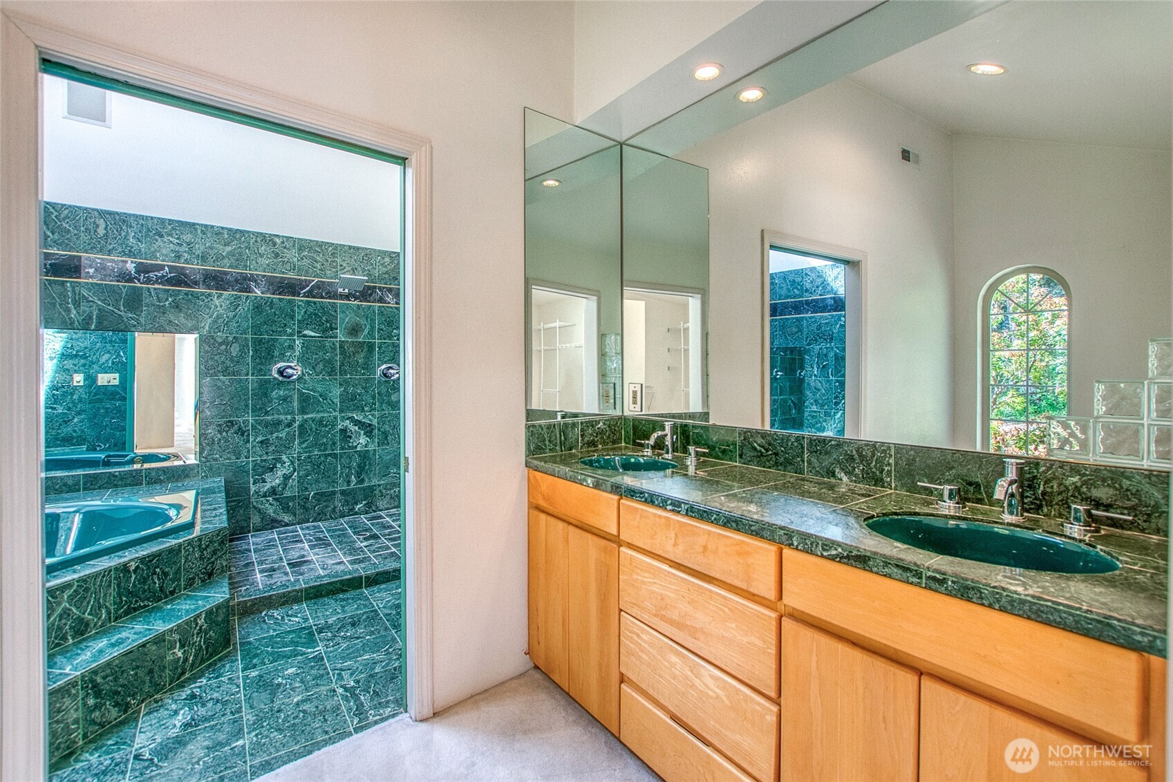 121 Switchback Road Orcas Island, WA 98245 - Photo 21 of 35 a bathroom with a granite countertop sink and a large mirror