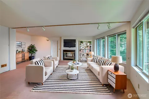 a living room with furniture and a large window