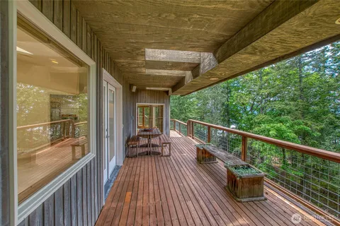 a view of balcony with chairs