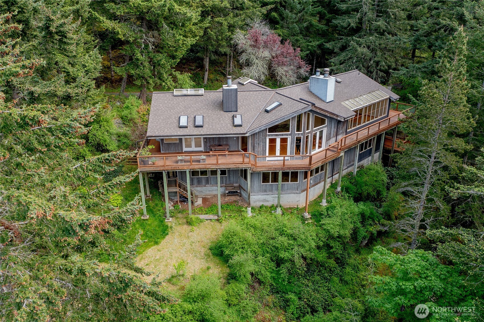 121 Switchback Road Orcas Island, WA 98245 - Photo 5 of 35 an aerial view of a house with a garden