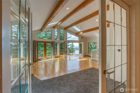 a view of an entryway with a floor to ceiling window