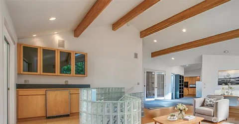 a living room with furniture and a window