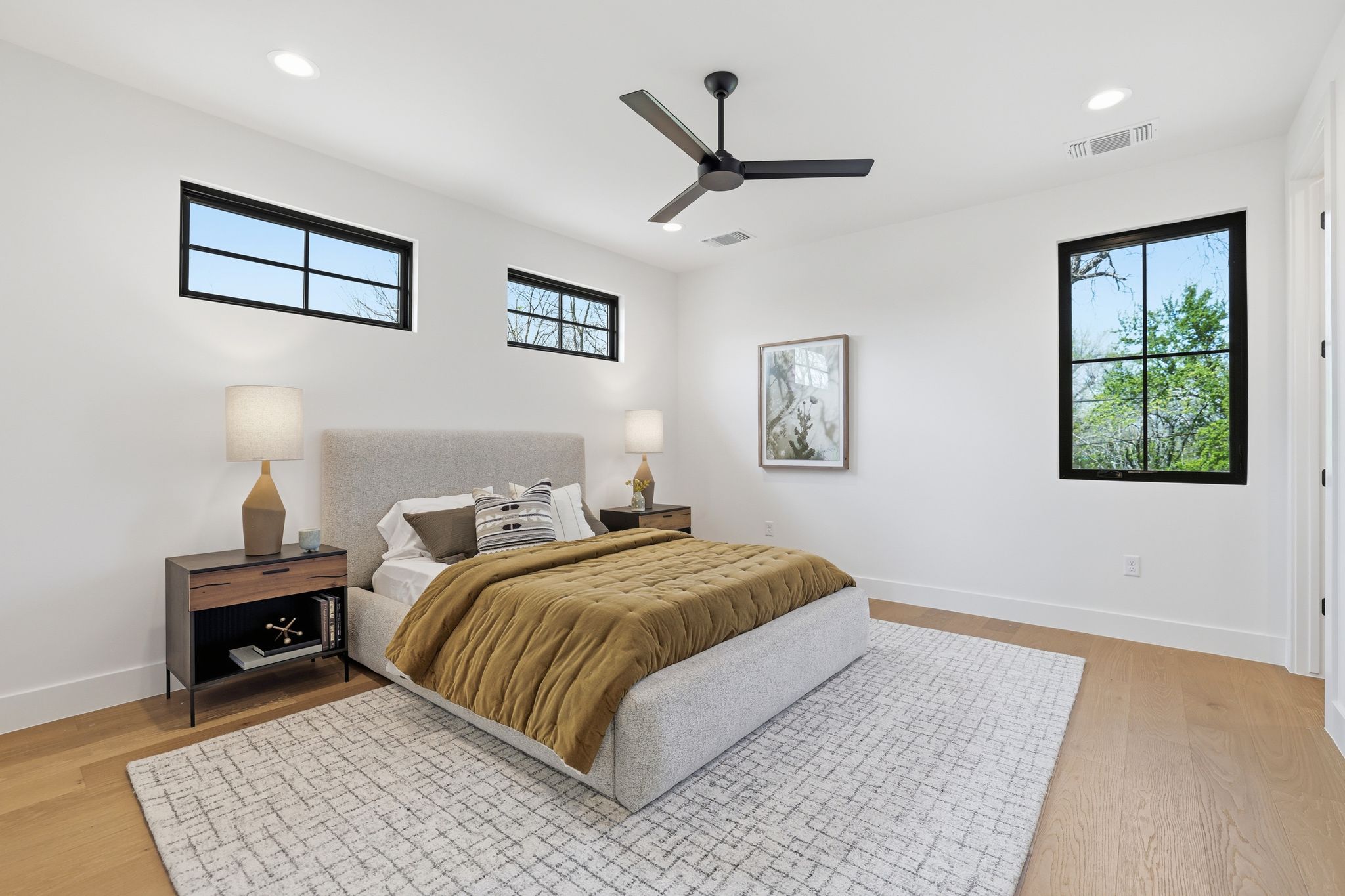 4500 Jinx Avenue Austin, TX 78745 - Photo 31 of 40 Bedroom featuring ceiling fan, light wood-style floors, recessed lighting, and multiple windows