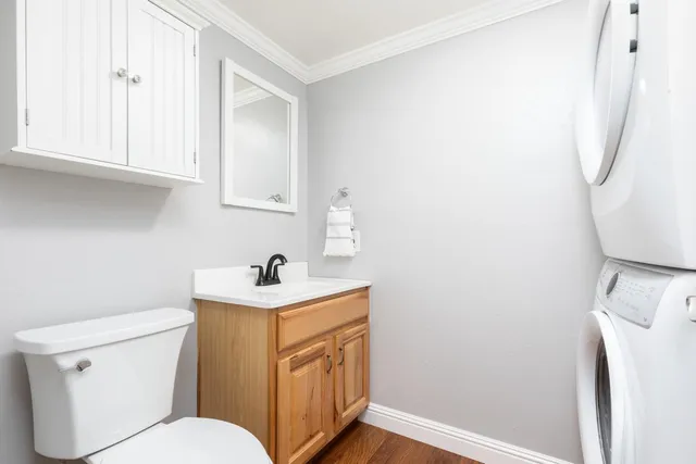 a bathroom with a sink a toilet and vanity