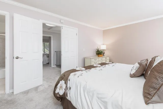 a bedroom with a bed and a cabinets