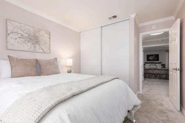 a bedroom with a bed and a walk in closet