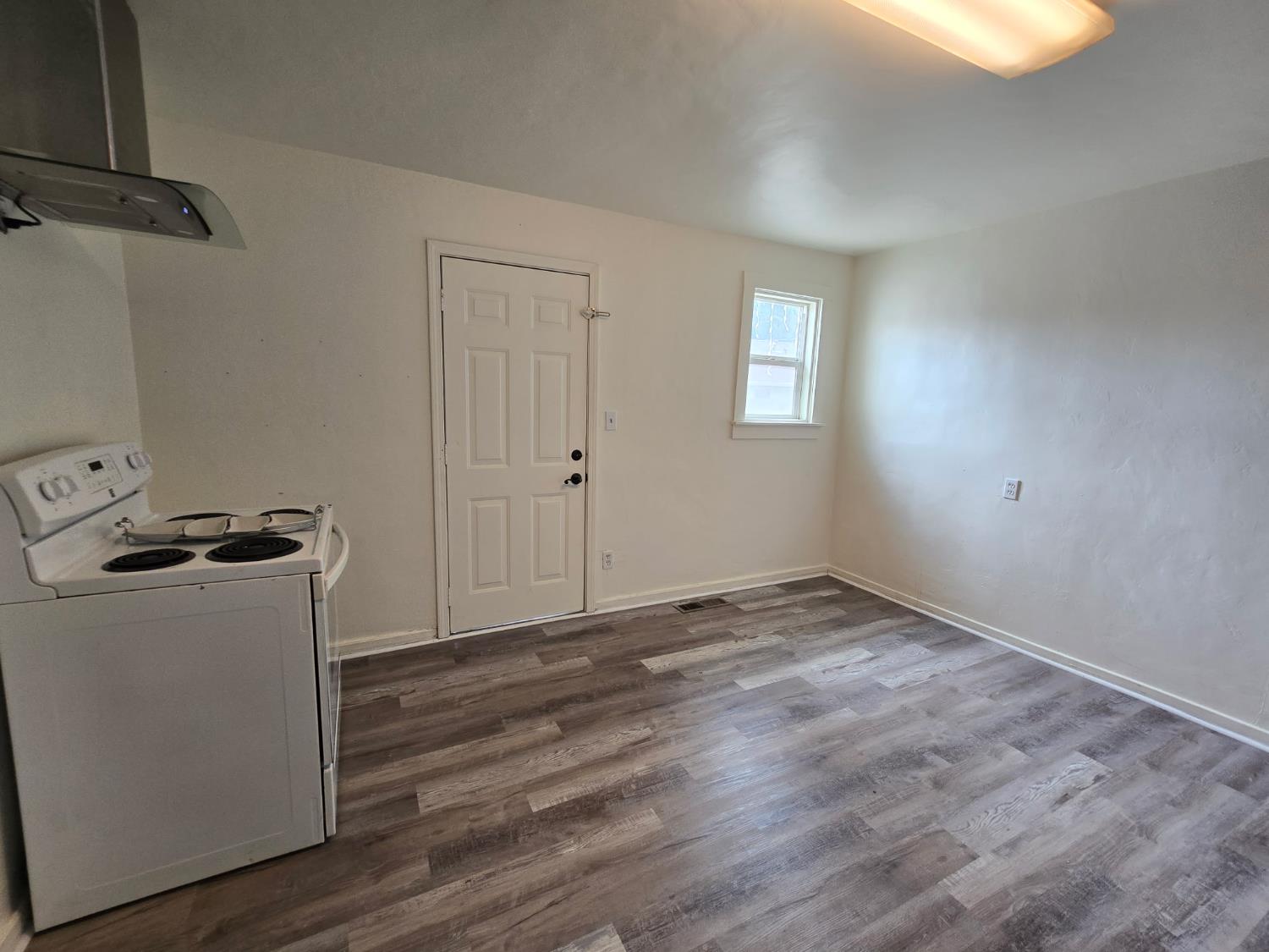 334 Semple Street Modesto, CA 95354 - Photo 15 of 28 a view of a room with wooden floor