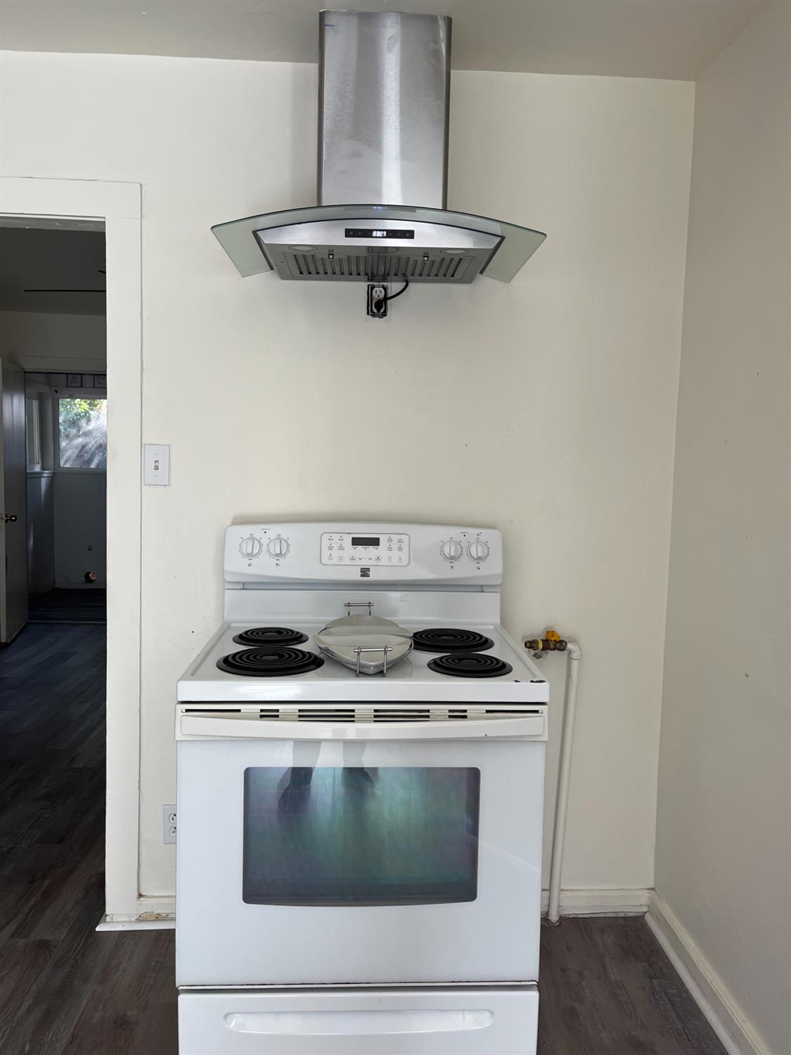 334 Semple Street Modesto, CA 95354 - Photo 16 of 28 a stove top oven sitting inside of a kitchen