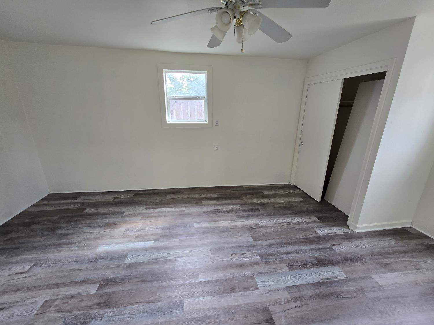 334 Semple Street Modesto, CA 95354 - Photo 18 of 28 a view of empty room with wooden floor