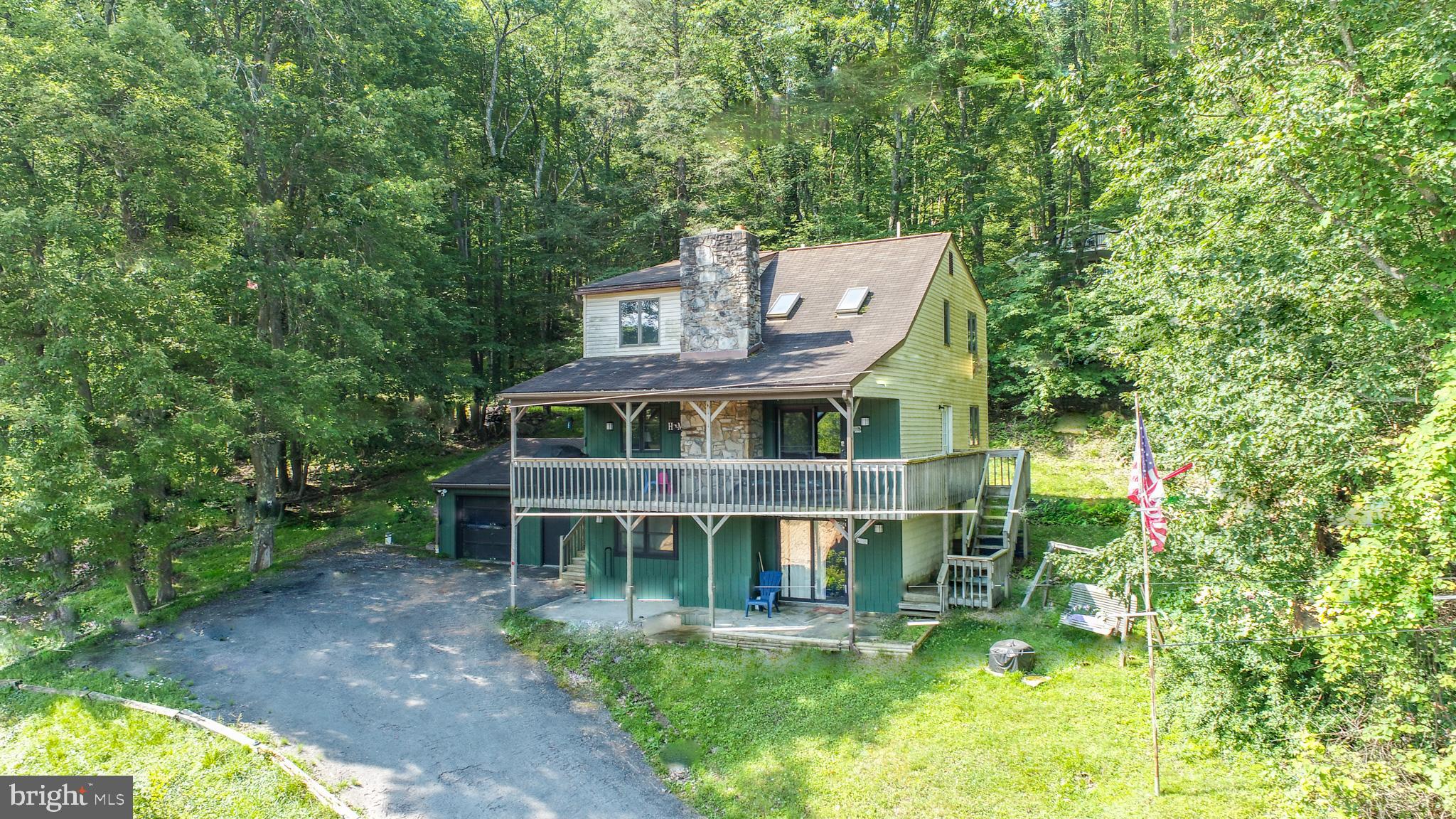 a front view of a house with a yard table and chairs