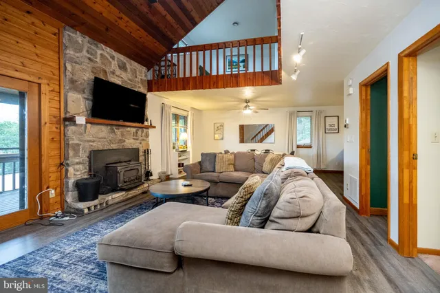 a living room with furniture and a rug