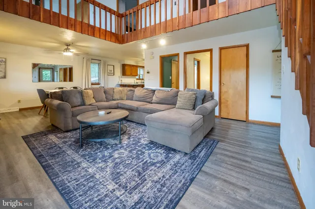 a living room with furniture fireplace and flat screen tv