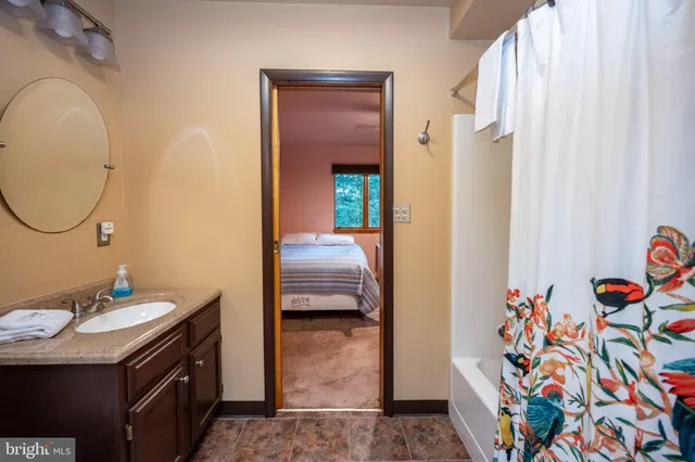 a bed room with a bed and a window