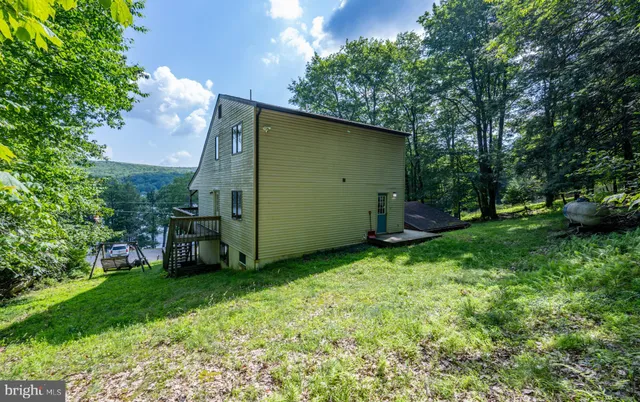 a view of a two chairs in the balcony
