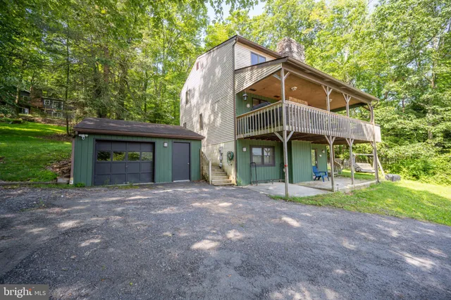 aerial view of a house with a yard