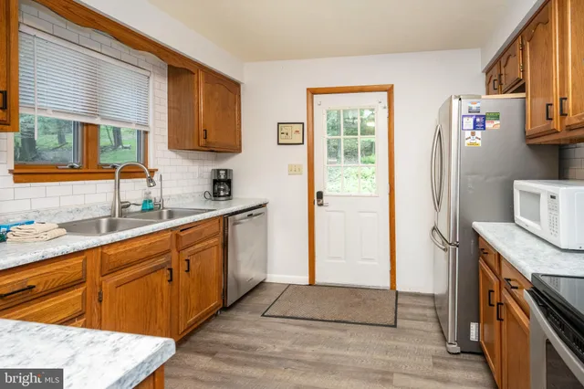 a view of a dining room with furniture and a flat screen tv