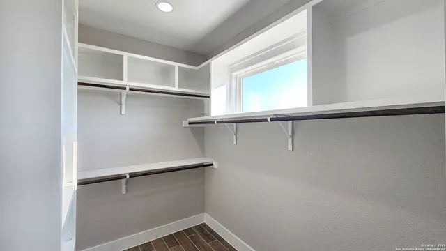 a view of an empty walk in closet