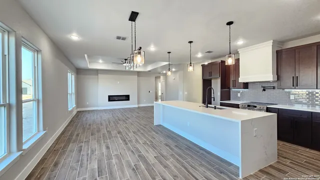 a large kitchen with stainless steel appliances kitchen island a large island in the center